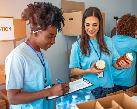Volunteers sort canned food donations.